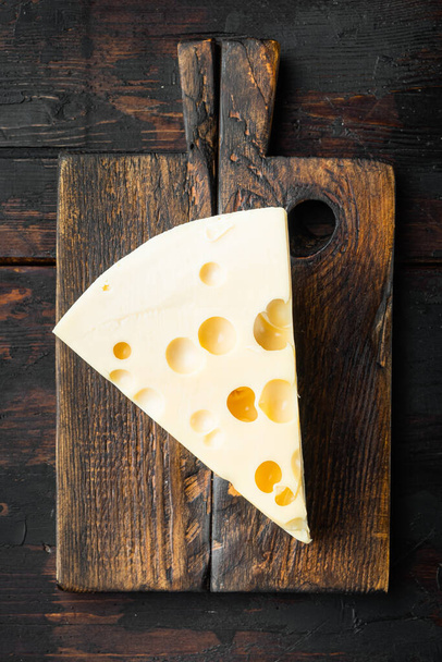 Maasdam cheese set, on old dark  wooden table, top view flat lay - Φωτογραφία, εικόνα