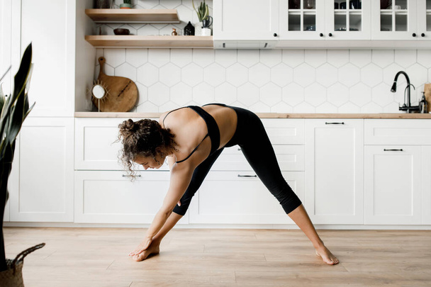 young woman doing yoga at home - Fotoğraf, Görsel