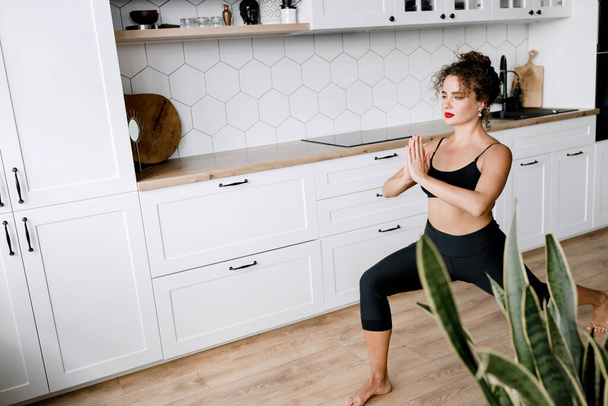 young woman doing yoga at home - Valokuva, kuva