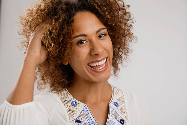 Portrait of a beautiful African American woman smiling - Фото, зображення