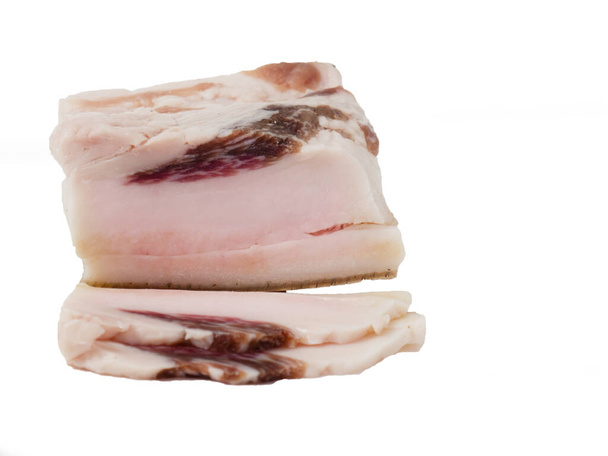 Slices of salted bacon on a white background. Healthy food with spices . salty fat, lard, - Photo, Image