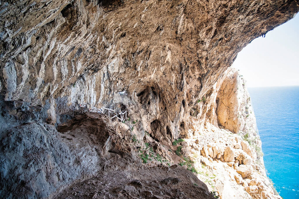 the beautiful caves of the forgers' cave, along the pilgrim's path that connects Varigotti to Noli, in Italy - Photo, Image