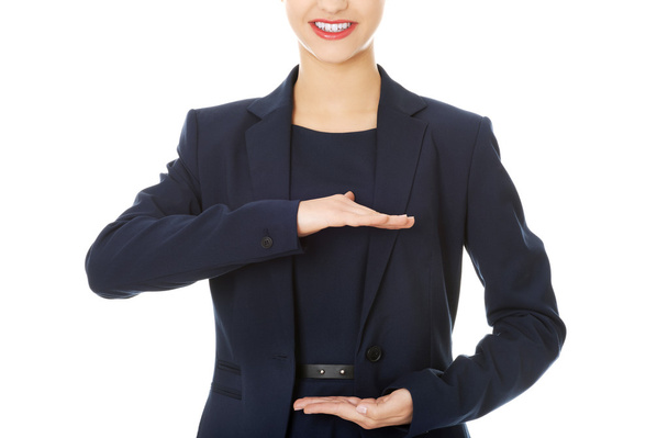 Business woman showing something or copyspase - Foto, immagini