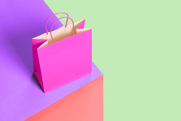 paper shopping bag on colorful box, shopping concept - Фото, изображение