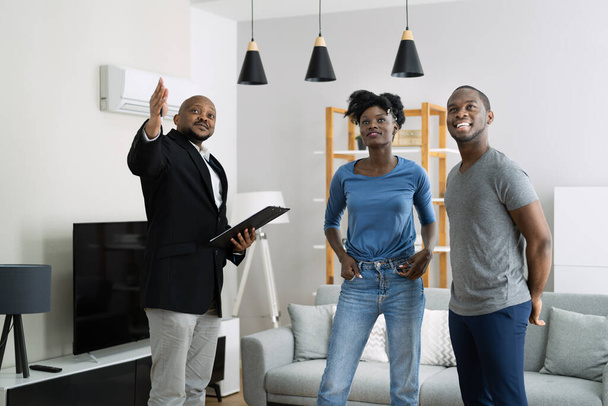 Agent Showing New Real Estate To African Couple - Fotoğraf, Görsel