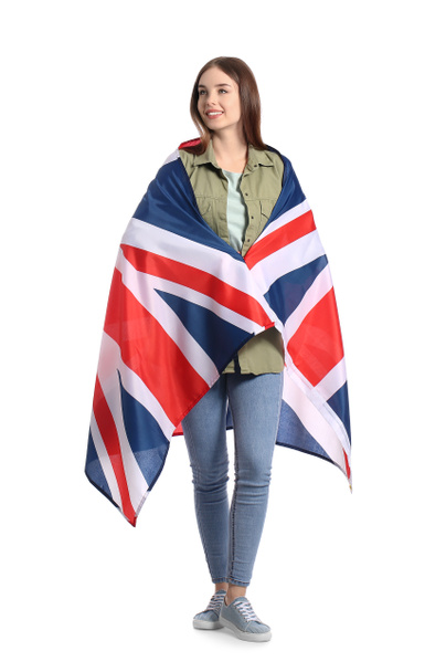 Mooie jonge vrouw met Britse vlag op witte achtergrond - Foto, afbeelding