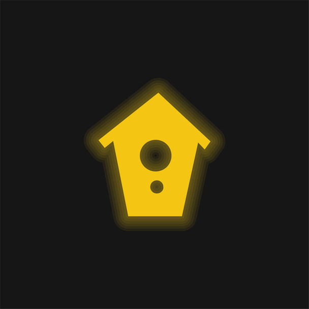 Casa de los pájaros amarillo brillante icono de neón - Vector, imagen