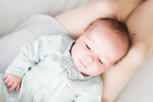 Lifestyle portrait of a newborn, three weeks old baby girl. - Photo, Image