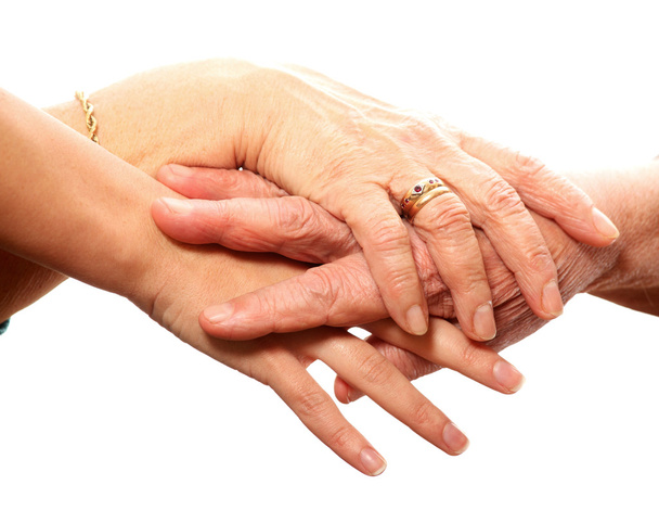 A picture of young and old hands against white background - Foto, Bild