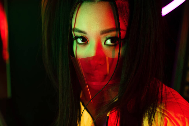 pretty young asian woman in face shield looking at camera  - Photo, Image