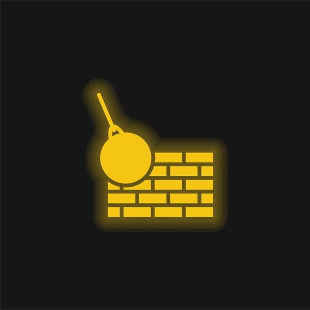 Cihly zeď a demolice koule žlutá zářící neon ikona - Vektor, obrázek