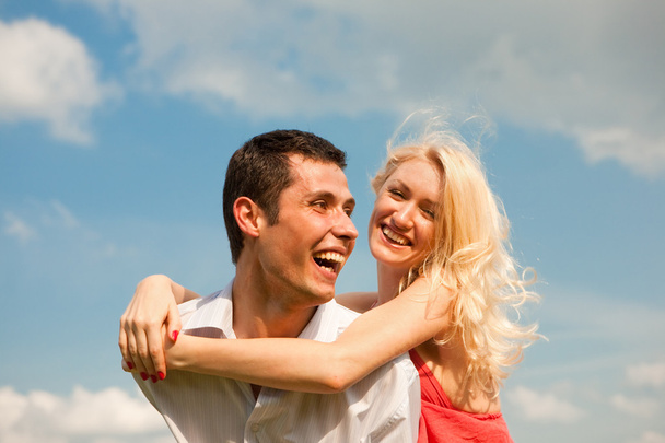 Young love Couple smiling under blue sky - Fotografie, Obrázek