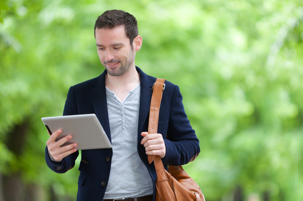 Young attractive man using tablet in Paris - Photo, Image
