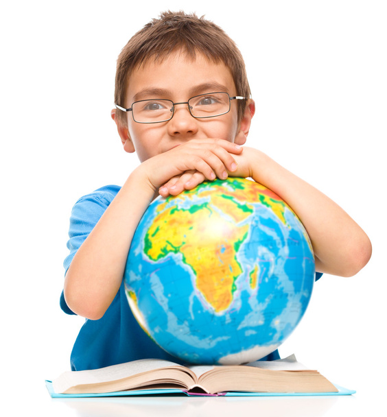 Little boy is holding globe - Φωτογραφία, εικόνα