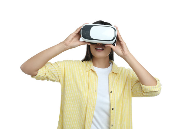 Woman using virtual reality headset on white background - Photo, Image