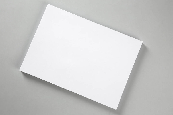 Blank brochure on grey background, top view. Mockup for design - Foto, Bild