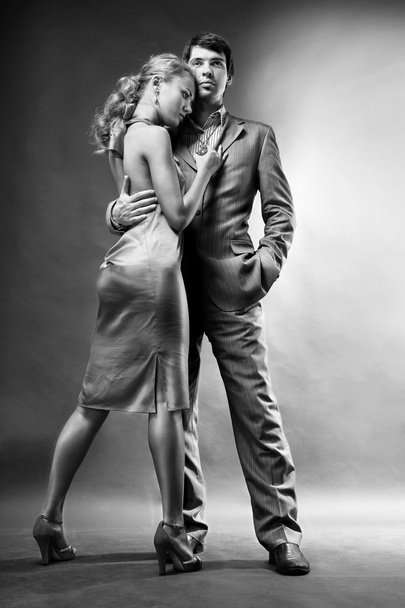 Portrait of a young beautiful couple. Young woman embraces man - Fotografie, Obrázek