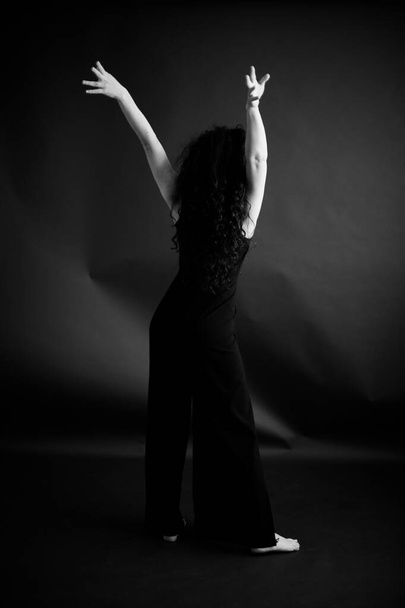 stylish dark fashion photography, the dancer moves freely - Фото, изображение