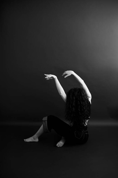 stylish dark fashion photography, the dancer moves freely - Photo, image