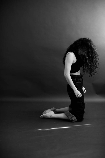 stylish dark fashion photography, the dancer moves freely - Фото, изображение