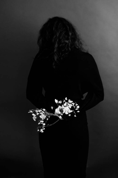 small daisy flowers on a woman, dark art abstract portrait - Photo, Image