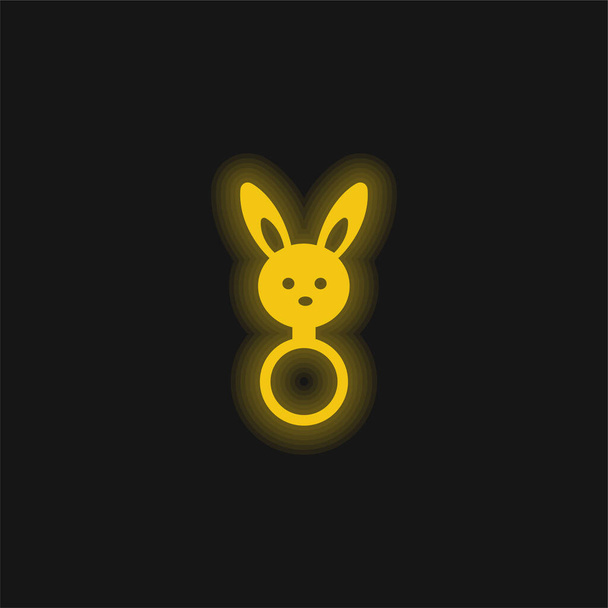 Babyrassel mit Hasenkopfform, gelb leuchtendes Neon-Symbol - Vektor, Bild