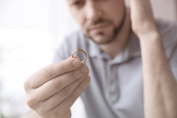 Man with wedding ring, closeup. Cheating and breakup - 写真・画像