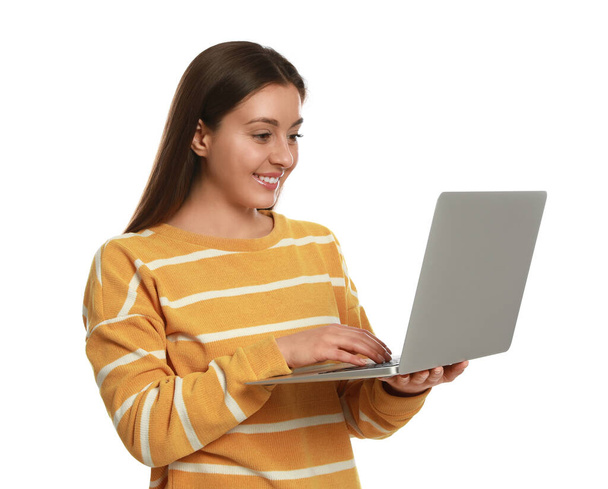 Young woman with modern laptop on white background - Foto, immagini