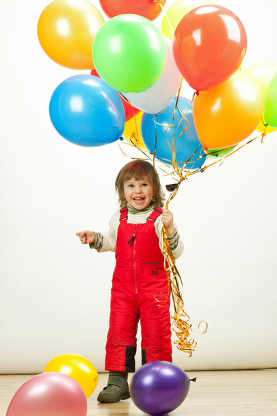 little girl in red jumping with balloons - Foto, immagini