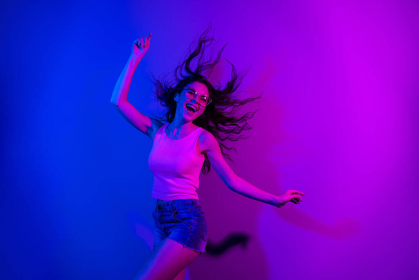 Photo of crazy cheerful lady have fun chilling open mouth smile free time weekend isolated on neon gradient background - Φωτογραφία, εικόνα