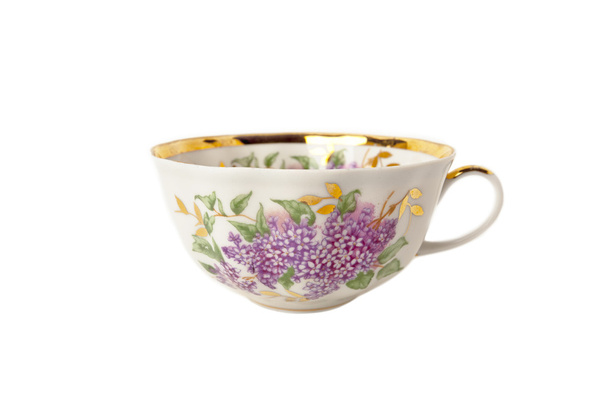 Xícara de porcelana com ornamento floral isolado sobre branco
 - Foto, Imagem