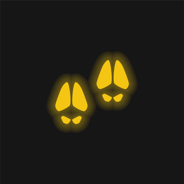 Hayvanın ayak izleri sarı parlak neon ikon - Vektör, Görsel