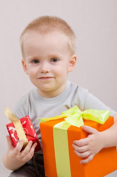 Happy child with gifts - Фото, изображение