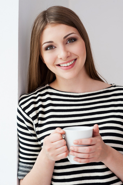 Woman holding cup - Photo, image