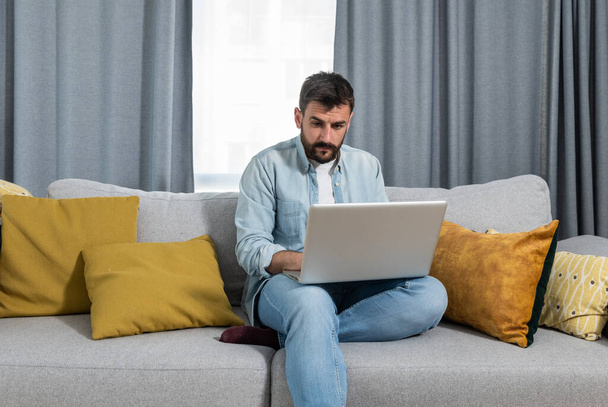 Young psychotherapist working at home in his home office as free online therapy doctor for people who cant afford medical treatment and advice in regular sessions  - Photo, image