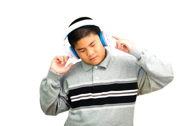 Boy listens attentively to the music. - Photo, Image