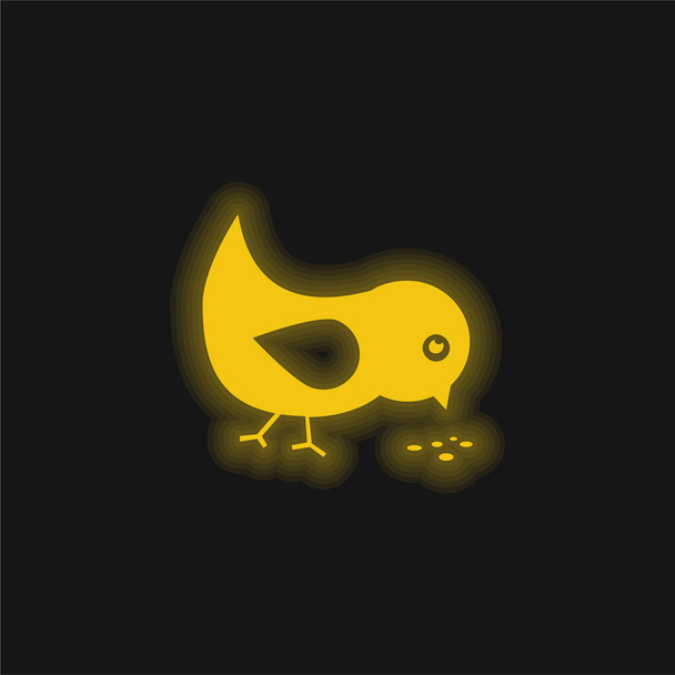 Bird Eating Seeds yellow glowing neon icon - Vector, Image