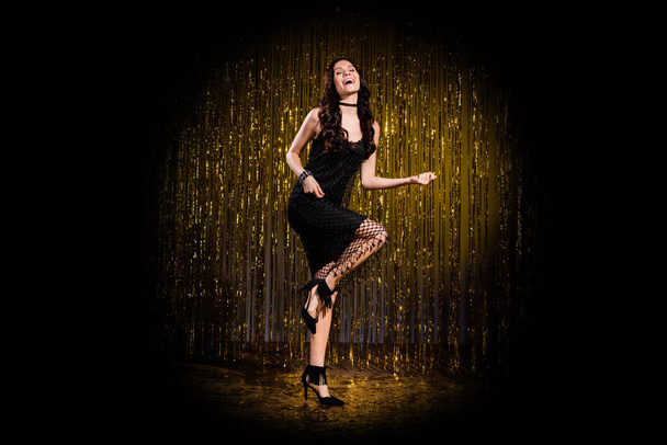 Full length photo of stunning girl happy positive smile party enjoy play guitar burlesque stilettos isolated over stage spot light - Фото, зображення