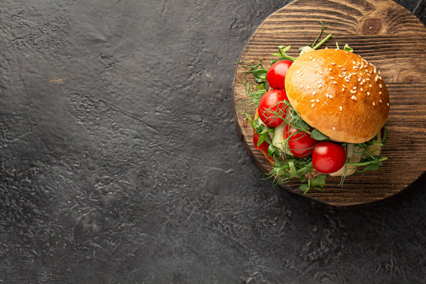 ready-made hot burger on the cutting board. Flat lay - Photo, Image