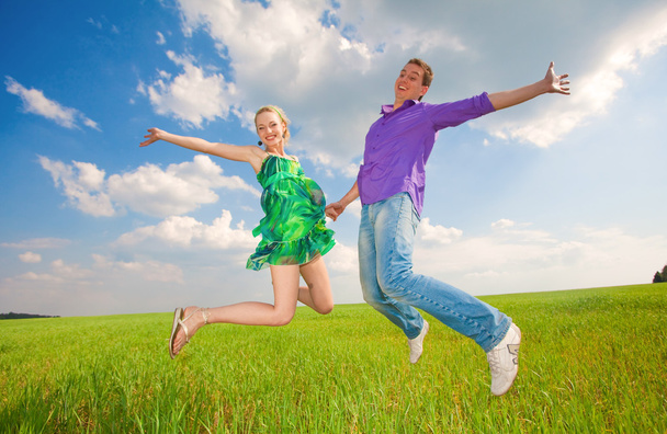 Happy is jumping in field - Photo, image