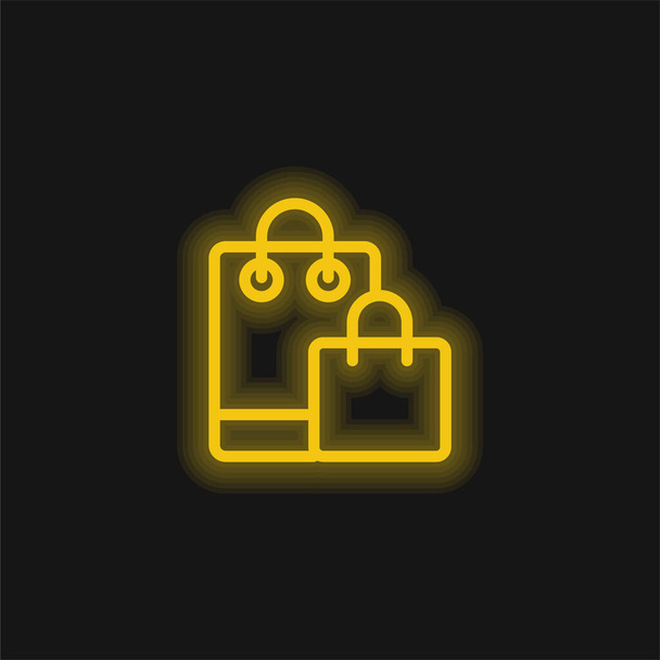 Bags yellow glowing neon icon - Vector, Image