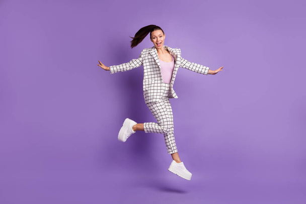 Full body photo of young excited woman happy positive smile have fun enjoy jump up isolated over violet color background - Valokuva, kuva