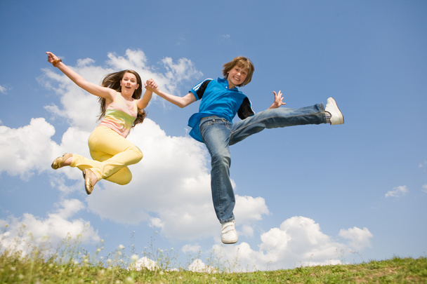 Girl and boy jumping. Soft focus. Focus on eyes - Photo, Image