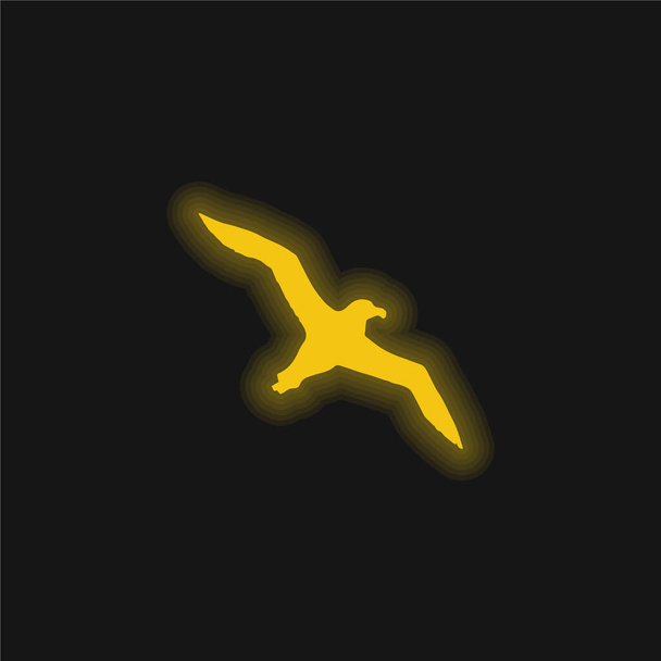 Albatroz pássaro voando forma amarelo brilhante ícone de néon - Vetor, Imagem