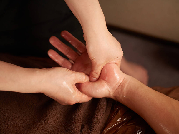 Asian man receiving hand massage - Photo, Image