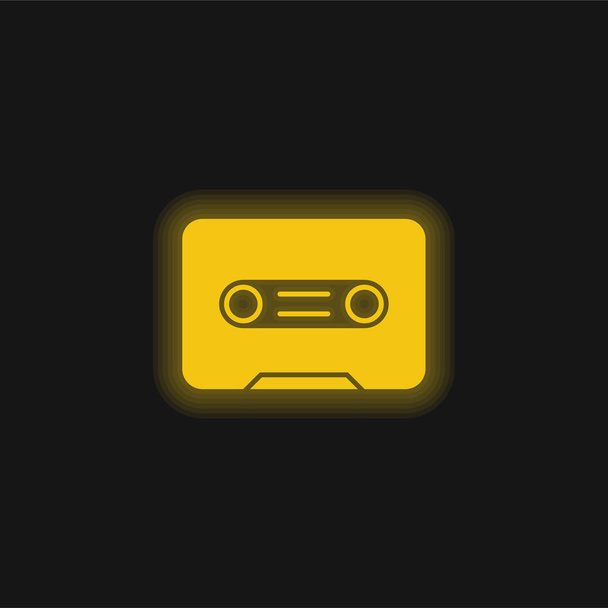 Big Cassette yellow glowing neon icon - Vector, Image