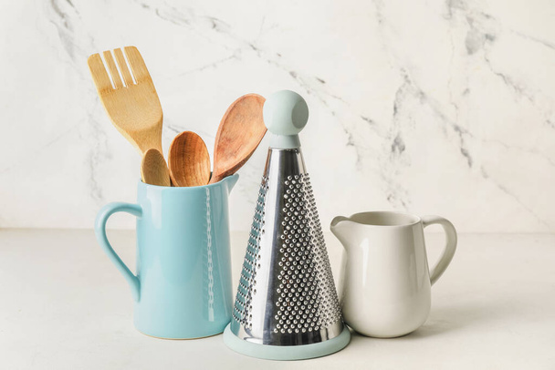Set of kitchen utensils on light background - 写真・画像