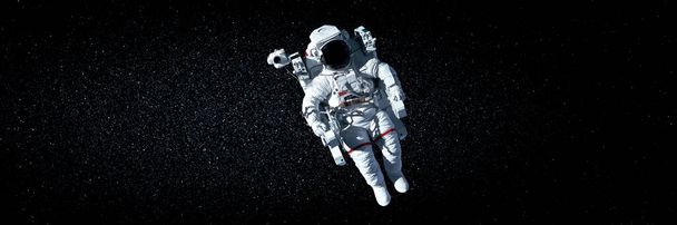 astronaute astronaute faire la sortie spatiale tout en travaillant pour la station spatiale - Photo, image