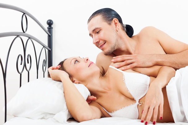 Loving middle-aged couple awaking together  - Фото, зображення