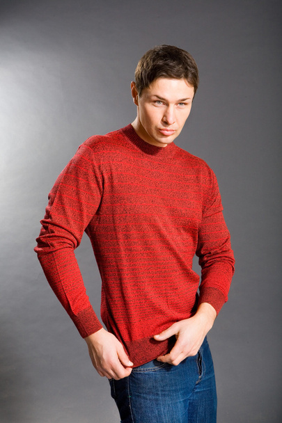 Young men dressed in sweater and jeans - Fotografie, Obrázek